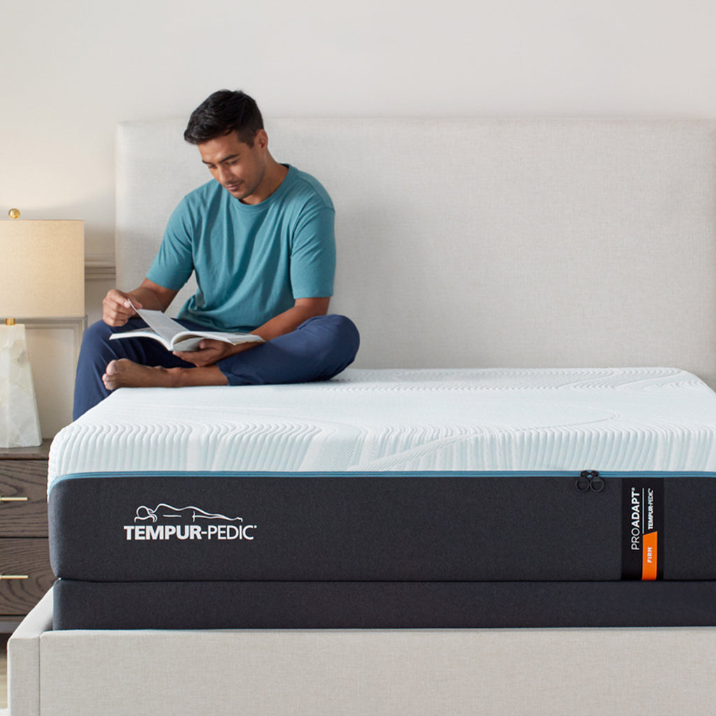 Tempur ProAdapt Firm Mattress, front view, man seated on bed